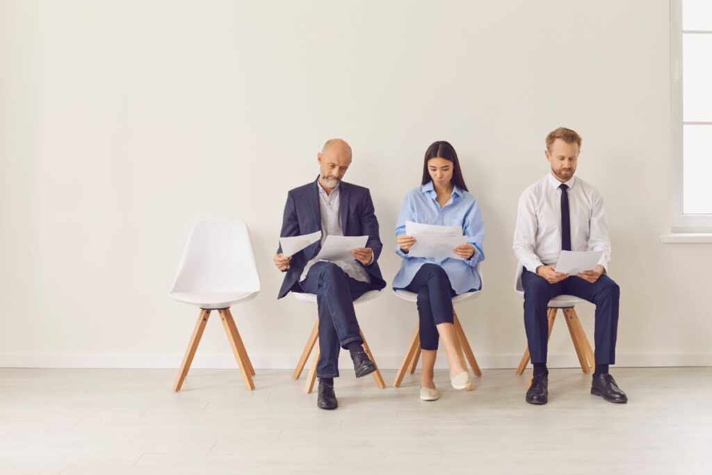 people waiting to be interviewed for new job